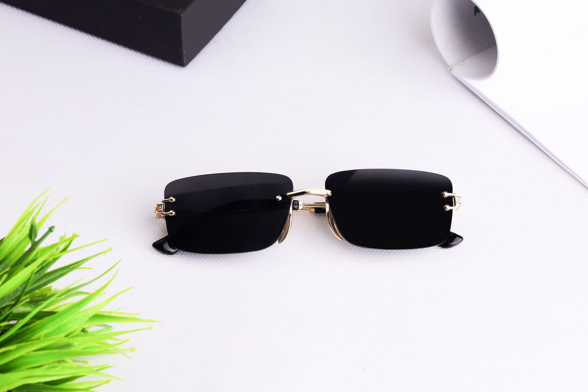 A microfiber cloth and acetate sunglasses on a clean surface